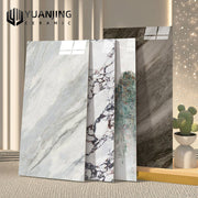 Các tấm gạch men vân đá với họa tiết đa dạng, có cây xương rồng nhỏ ở góc phải.