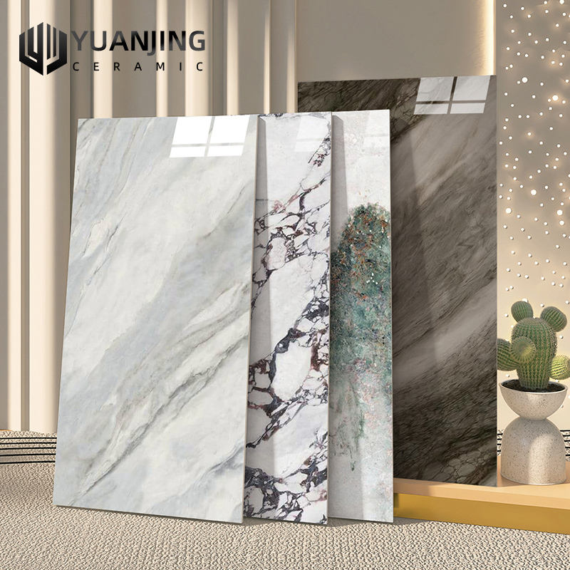 Các tấm gạch men vân đá với họa tiết đa dạng, có cây xương rồng nhỏ ở góc phải.