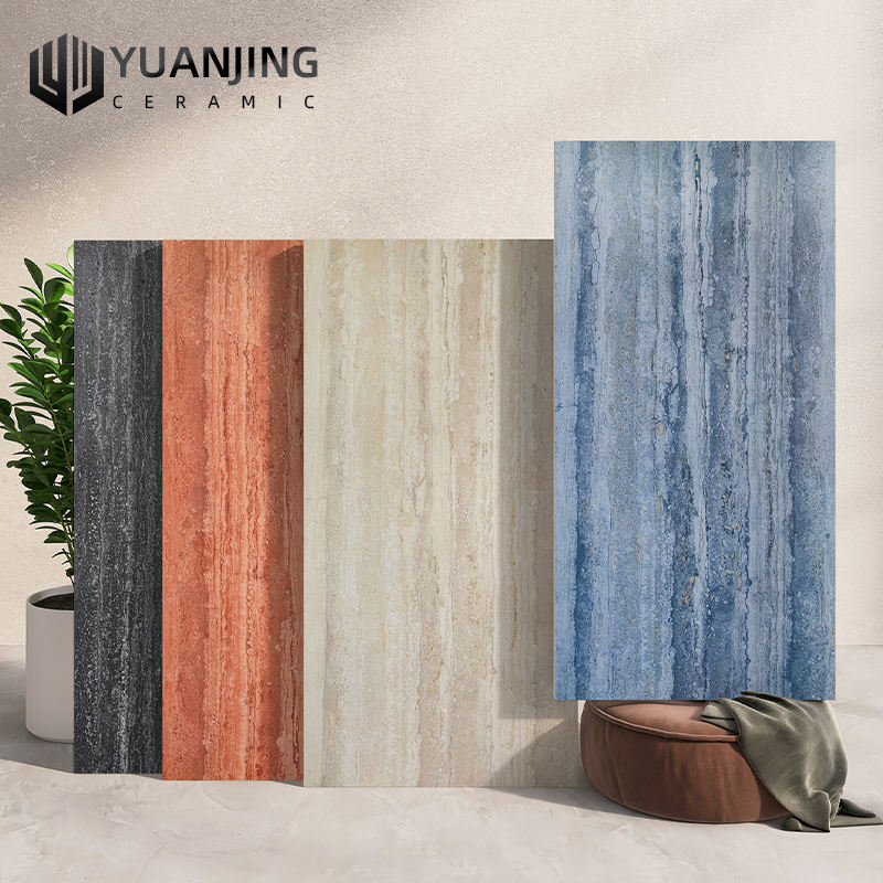 Bốn tấm gạch đứng, màu đen, đỏ, be, xanh, đặt cạnh nhau, nền sáng, có cây xanh bên trái.