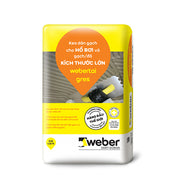 Bao bì màu vàng trắng, có hình ảnh keo dán gạch, logo Weber và chữ in nổi bật.