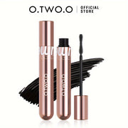 Mascara O.TWO.O màu vàng đồng, có cọ chuốt, nền vệt màu đen, chữ "Official Store".